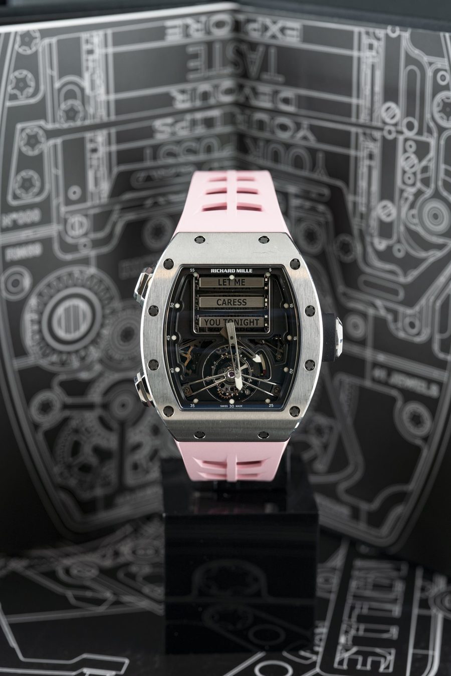 RM 69 full watch on dark graphic backdrop
